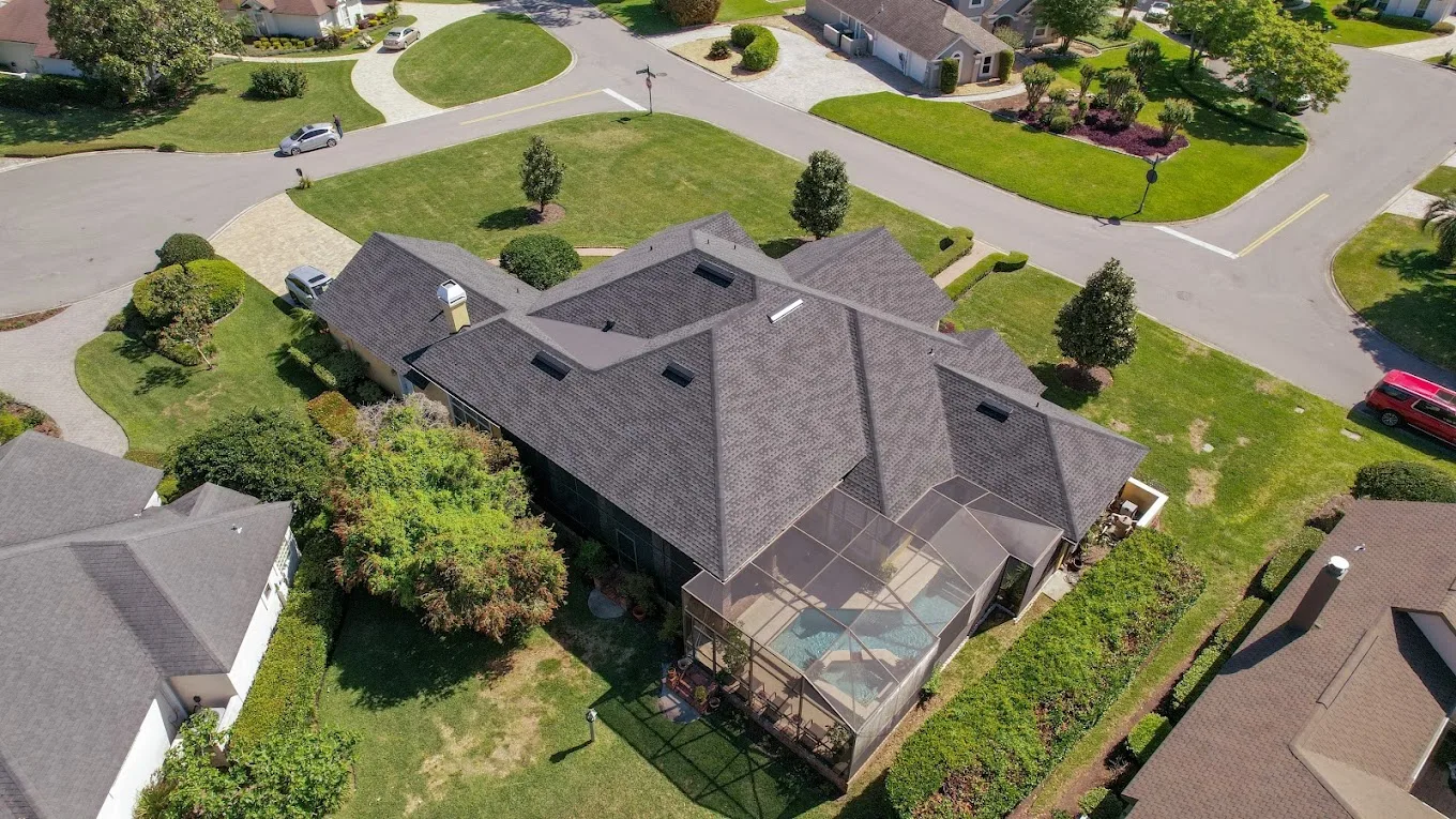Aerial view of a gray shingle roof on a residential home.